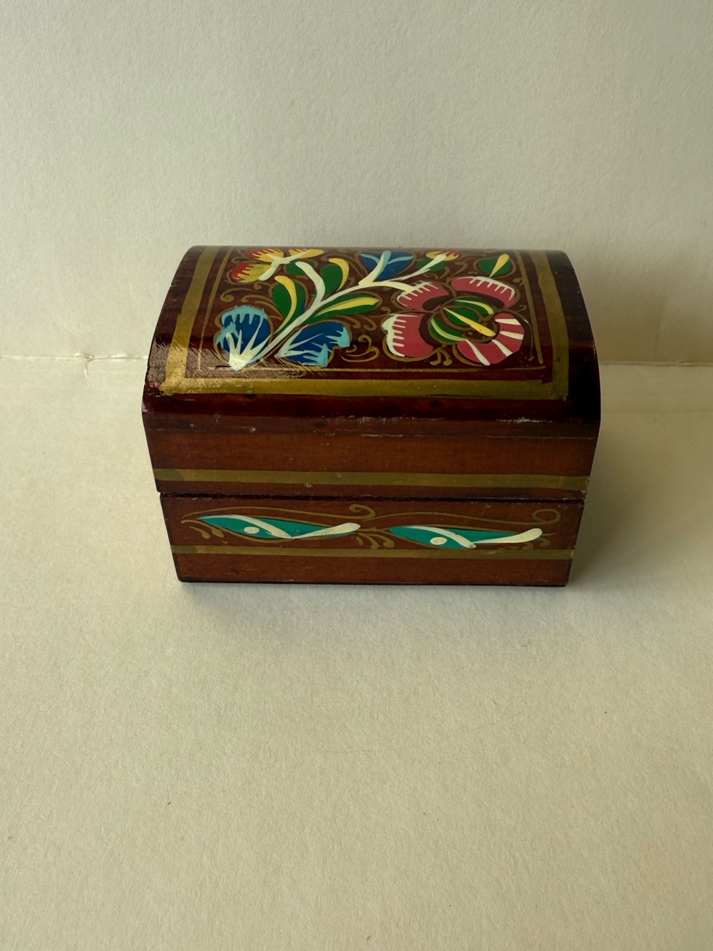 Vintage Hand-Painted Wooden Decorative Trinket Box with Colorful Floral Motif.